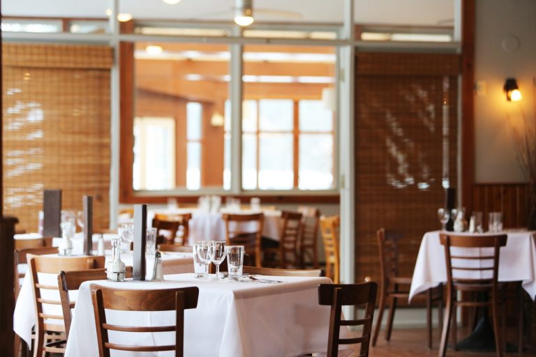 a restaurant with tables and chairs