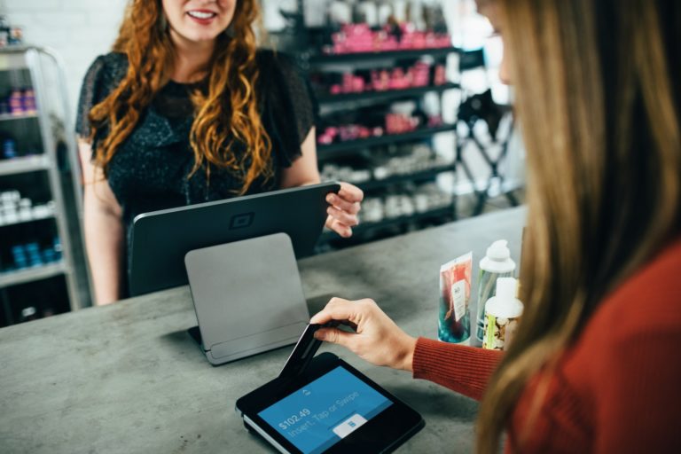 a woman and a girl looking at a tablet