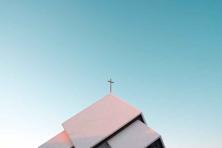 a cross on top of a roof