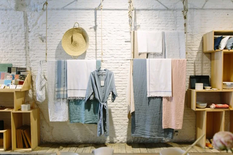 a room with clothes on the wall