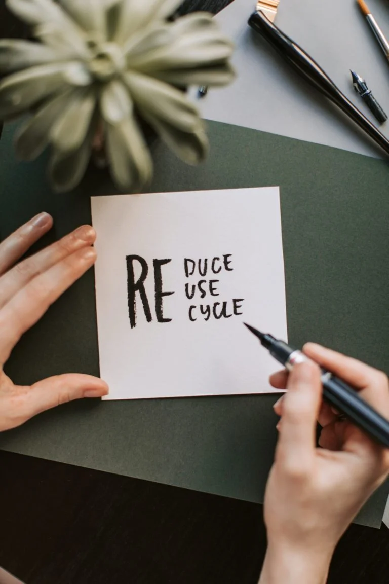 a person writing on a white board