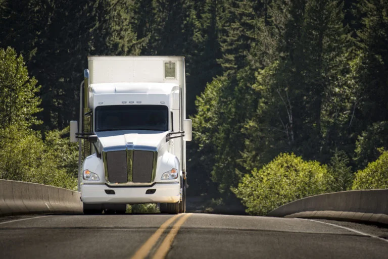 a white truck on the road