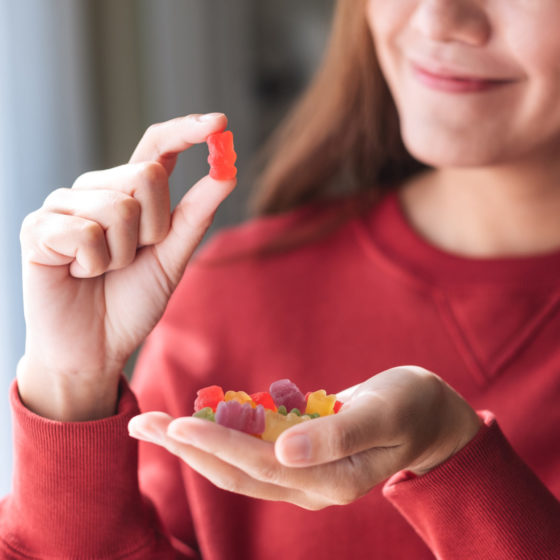 woman getting ready to eat gummies