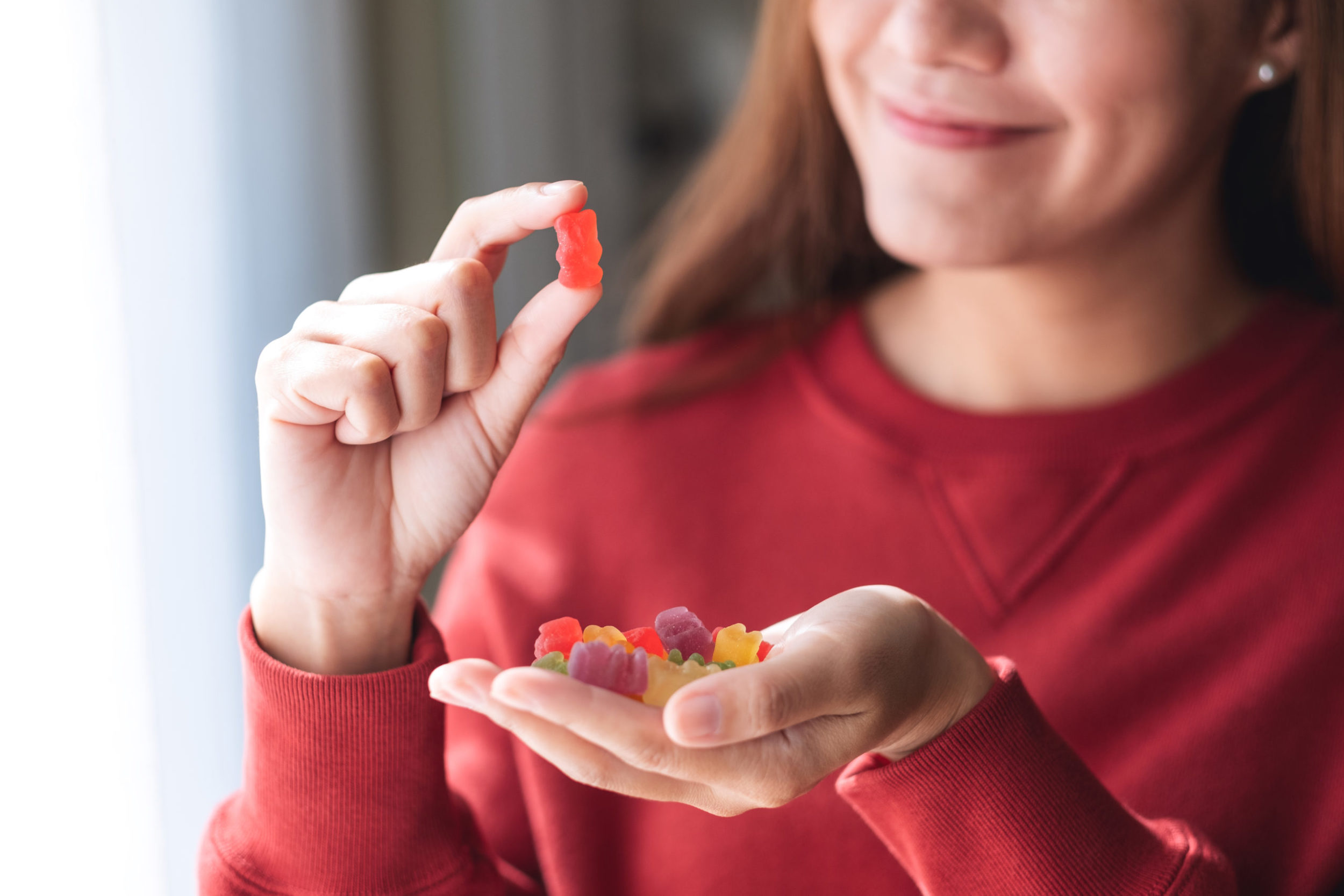 woman getting ready to eat gummies